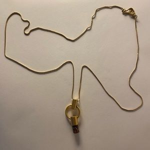 Gold necklace with stone pendant